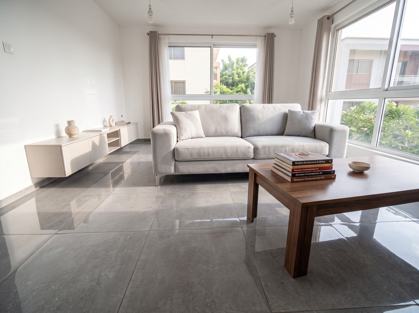 Design-reference living room with a sofa and large windows — after
